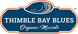 A logo featuring an illustration of a blue mussel with orange accents. Below the mussel drawing, the text "THIMBLE BAY BLUES" is prominently displayed in white uppercase letters. Underneath, the words "Organic Mussels" are written in a cursive script.