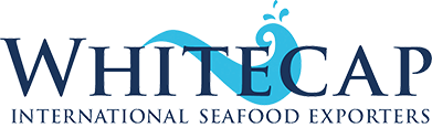 Logo of Whitecap International Seafood Exporters featuring large, bold text with "WHITE" in dark blue and "CAP" in light blue. A stylized light blue fish graphic is integrated into the letter "C". Below is smaller text stating "INTERNATIONAL SEAFOOD EXPORTERS".